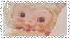 Stamp with a close up of a yellow cat Rushton doll